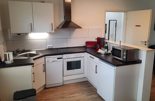 Seeholz Apartment | Cozy Holiday Apartment in Holzdorf with Kitchen & Breakfast
