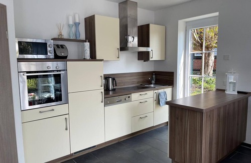 Kopendorf House | Holiday Home 'Haus Am Dorfteich A E-Laden Möglich' with Private Terrace, Shared Garden and Wi-Fi