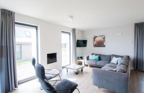 Tholen House | Relax at Holiday Home Oesterdam Resort with Oceanfront Views