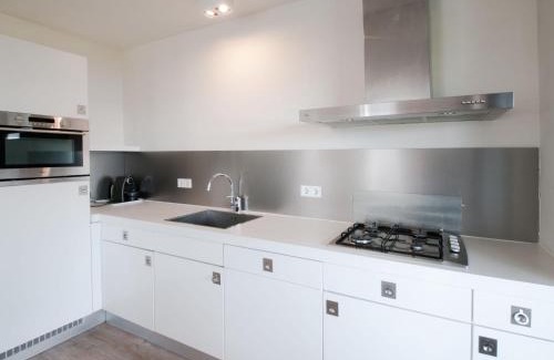 Tholen House | Relax at Holiday Home Oesterdam Resort with Oceanfront Views