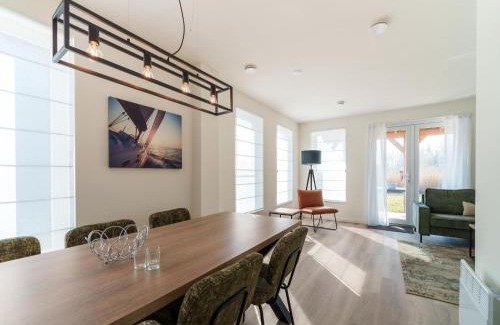 Municipality of Nissewaard House | Relaxing Holiday Home with Sauna by a Scenic Lake
