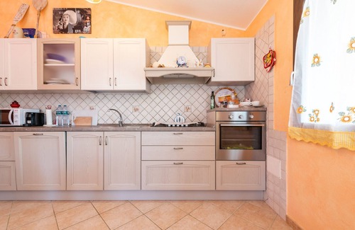 Solanas House | Inviting Holiday Home 'Villetta Delfino' with Ocean View