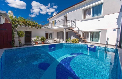 Tribalj House | Inviting Holiday Home with Pool and Oceanfront Views