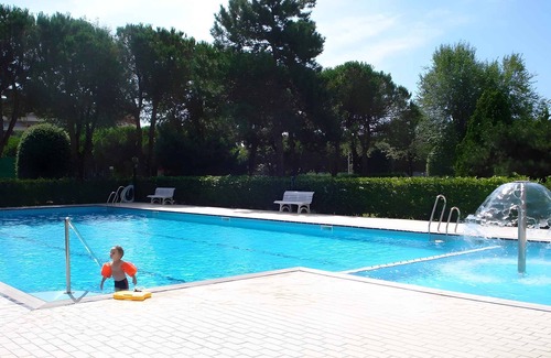 Porto Santa Margherita Apartment | Holiday apartment Apartment with swimming pool surrounded by a garden
