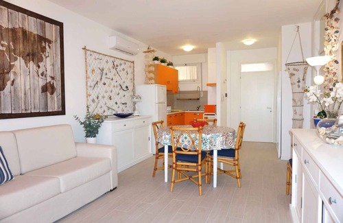 Porto Santa Margherita Apartment | Beachfront Two-Bedroom Apartment with Family-Friendly Amenities