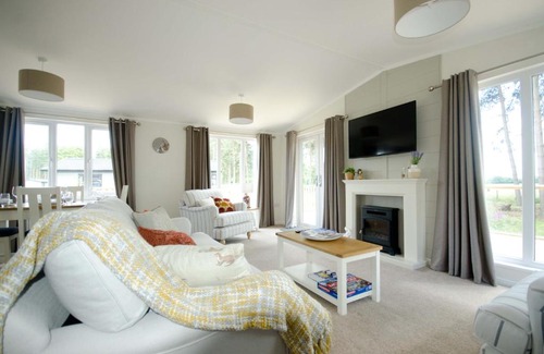Ryther Cabin | Explore Hollicarrs - Woodland Lodge with Hot Tub & Pets Welcome
