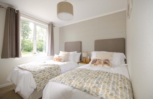 Ryther Cabin | Explore Hollicarrs - Woodland Lodge with Hot Tub & Pets Welcome