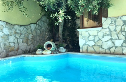 Giugliano in Campania Apartment | Relaxing Oceanfront Apartment with Pool Near the Beach