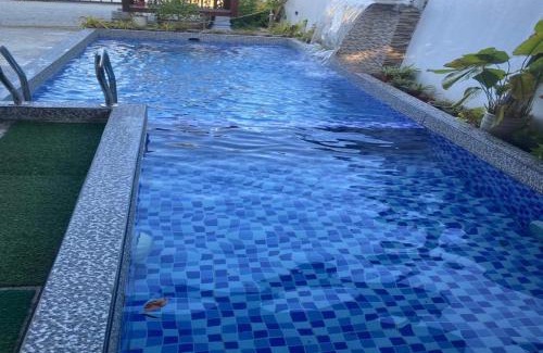 Jerteh House | Inviting Homestay Durian Belanda: Poolside Relaxation Awaits
