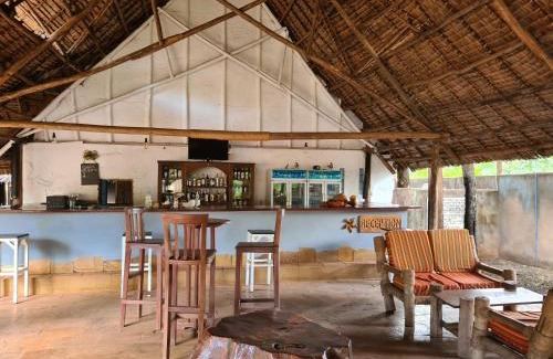 Moshi Hotel | Relax at Honey Badger Lodge with Pool & Spa Amenities