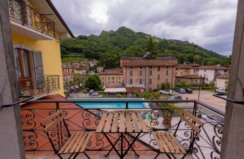 San Pellegrino Terme Apartment | Relax at Exclusive Liberty Spa with Inviting Pool Access