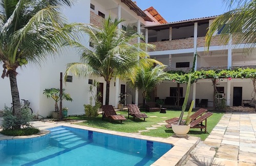 Colonia de Pescadores Apartment | Beachfront Escape at Hospedaria Cumbuco with Pool & Views