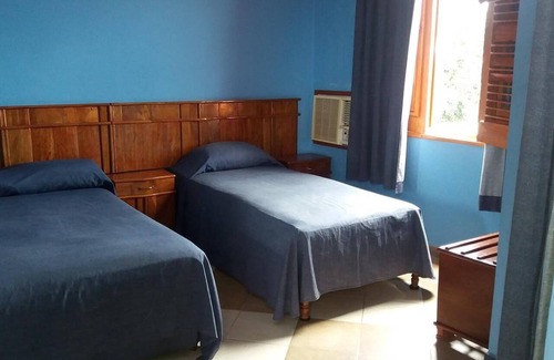 Cienfuegos House | Relax at Hostal Amelia: Spa, Dining & Family Friendly