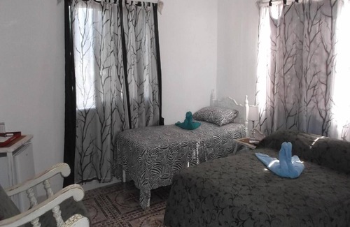 Cienfuegos House | Discover Hostal Casa Las Palmas with Spa & Family Comfort