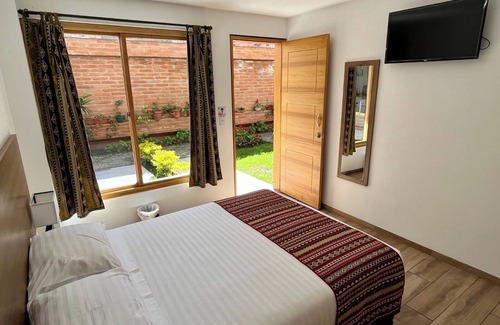Otavalo Hotel | Discover Relaxation at Hostal El Geranio with Spa & Dining