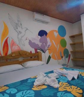 Capurgana Hotel | Discover Hostal Las Flores: Family-Friendly with Breakfast