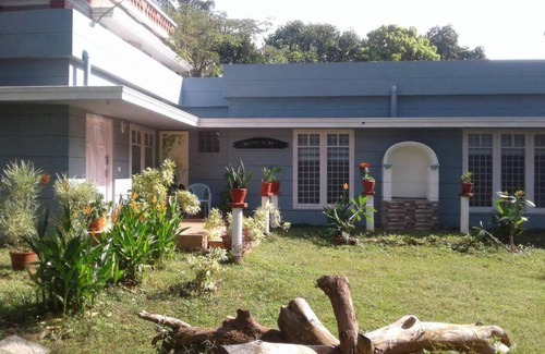 Thiruvananthapuram Hostel | Vibrant Party House Guest Rooms with Cozy Fireplace