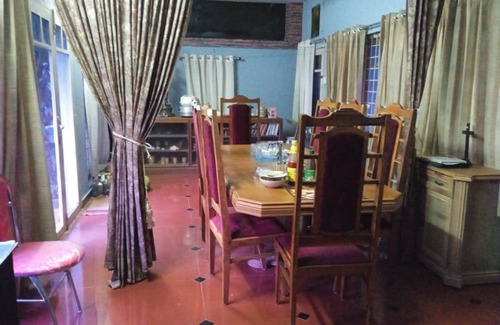 Thiruvananthapuram Hostel | Vibrant Party House Guest Rooms with Cozy Fireplace