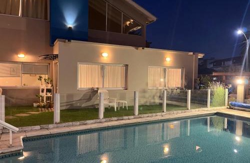 Villa Gesell Hotel | Discover Hostería Magnolia: Family-Friendly with Pool Access