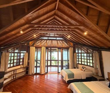 Puerto Lopez Hostel | Pet-Friendly Hostería Mandála with Oceanfront Pool Access
