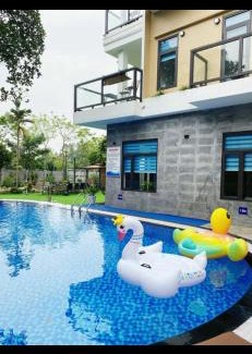 Soc Son Villa | Hosu Villa: Oceanfront Retreat with Pool & Pet-Friendly Perks
