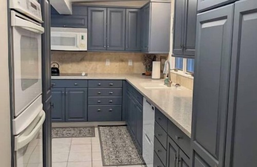 Manhattan House | Hot Tub and Game room! Center of Town, walking distance to ball games & College.