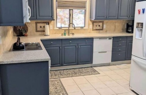 Manhattan House | Hot Tub and Game room! Center of Town, walking distance to ball games & College.