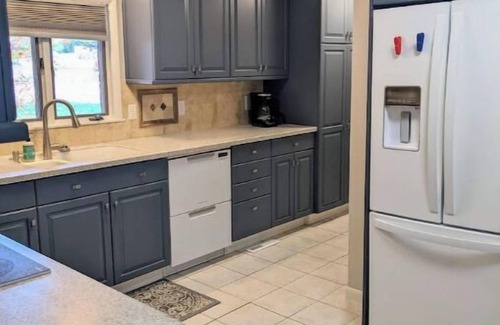 Manhattan House | Hot Tub and Game room! Center of Town, walking distance to ball games & College.