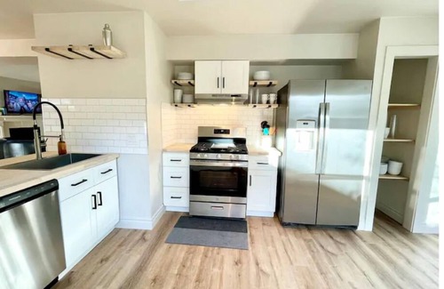 Milwood House | Relaxing Hot Tub Retreat: Chic Domain 4 BR + Foosball
