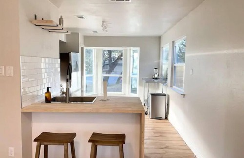 Milwood House | Relaxing Hot Tub Retreat: Chic Domain 4 BR + Foosball