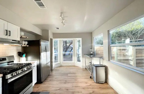 Milwood House | Relaxing Hot Tub Retreat: Chic Domain 4 BR + Foosball
