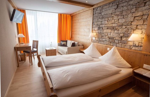 Wolfenschiessen Hotel | Experience Berghotel Trübsee: Family Rooms & Hot Tub Oasis