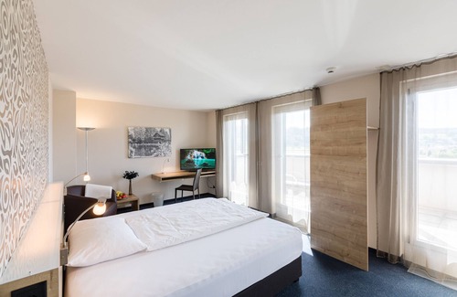 Oberentfelden Hotel | Discover Hotel aarau-WEST: Eco-Friendly Comfort Awaits
