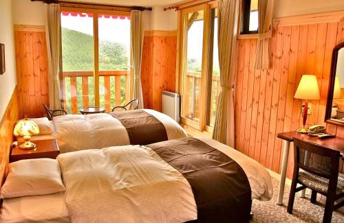 Nagawa Resort | Inviting Hotel Andermatt: Family-Friendly with Hot Tub Access