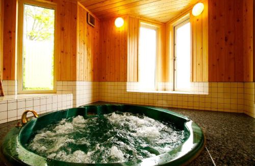 Nagawa Resort | Inviting Hotel Andermatt: Family-Friendly with Hot Tub Access