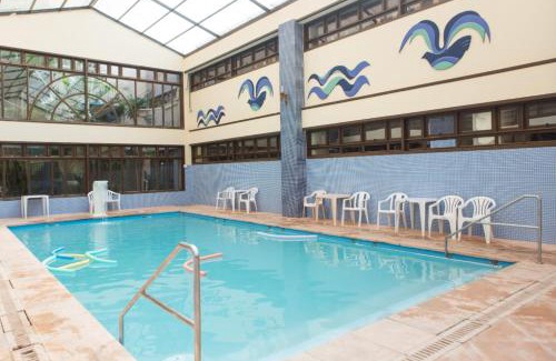 Capao da Canoa Hotel | Discover Hotel Araçá: Oceanfront Bliss with Pool Access