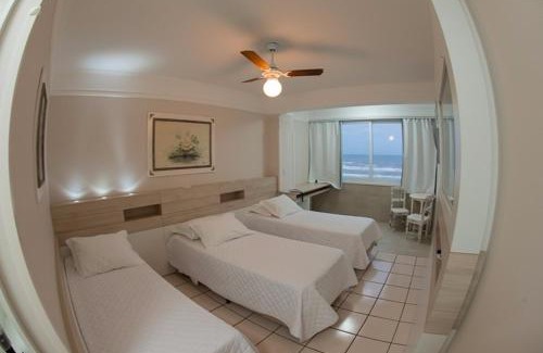 Capao da Canoa Hotel | Discover Hotel Araçá: Oceanfront Bliss with Pool Access
