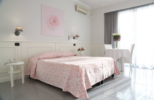Giugliano in Campania Hotel | Discover Hotel Barbarella: Poolside Relaxation Awaits