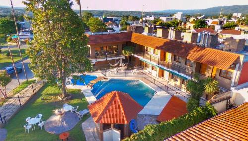 Villa Carlos Paz Hotel | Discover Hotel Carlos Paz: Oceanfront Retreat with Pool