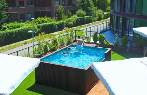 Mendizorrotza Apartment | Discover Sercotel Jardines de Uleta Suites: Pet-Friendly Retreat