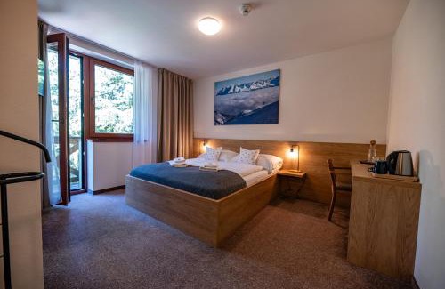 Jasna Hotel | Hotel Jasná: Relax with Spa, Hot Tub & Family-Friendly Fun