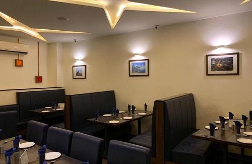 Khambhaliya Hotel | Guest Rated: Hotel Kalyan's - Mansingh Inn with Fireplace