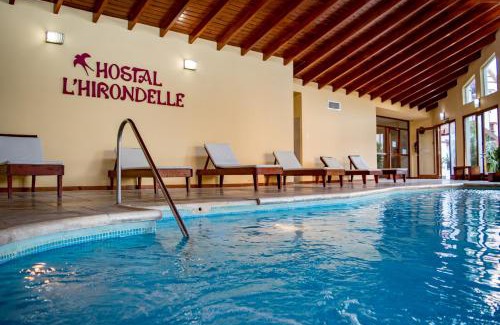 La Falda Hotel | Discover Hostal L' Hirondelle: Rated 9/10 with Pool & Hot Tub