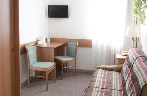 Srodmiescie Hotel | Budget-Friendly Hotel Logos: Pet Friendly & Family Welcoming