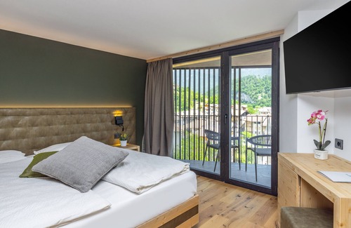 San Lorenzo in Banale Hotel | Discover Hotel Miravalle: Poolside Haven for Families