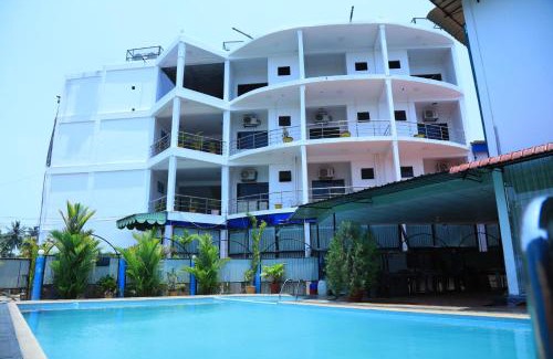 Irampaikkulam Hotel | Discover Nelly Star Hotel: Family-Friendly with Pool & Dining