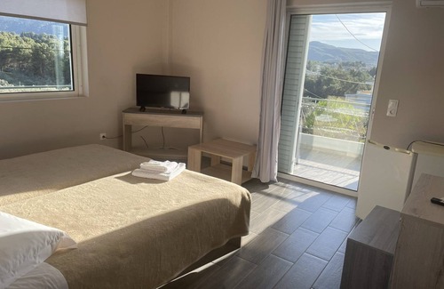 Skala Oropou Hotel | Discover Hotel Paradise: Eco-Friendly Retreat with Dining