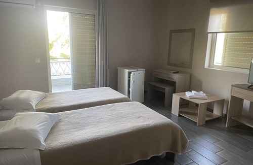 Skala Oropou Hotel | Discover Hotel Paradise: Eco-Friendly Retreat with Dining