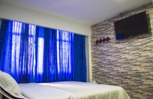 Fontibon Hotel | Budget-Friendly Hotel Punto 100 with Breakfast & Family Perks