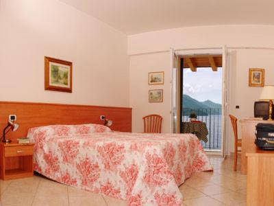 Gravedona Hotel | Discover Hotel Regina: Oceanfront Stay with Private Beach